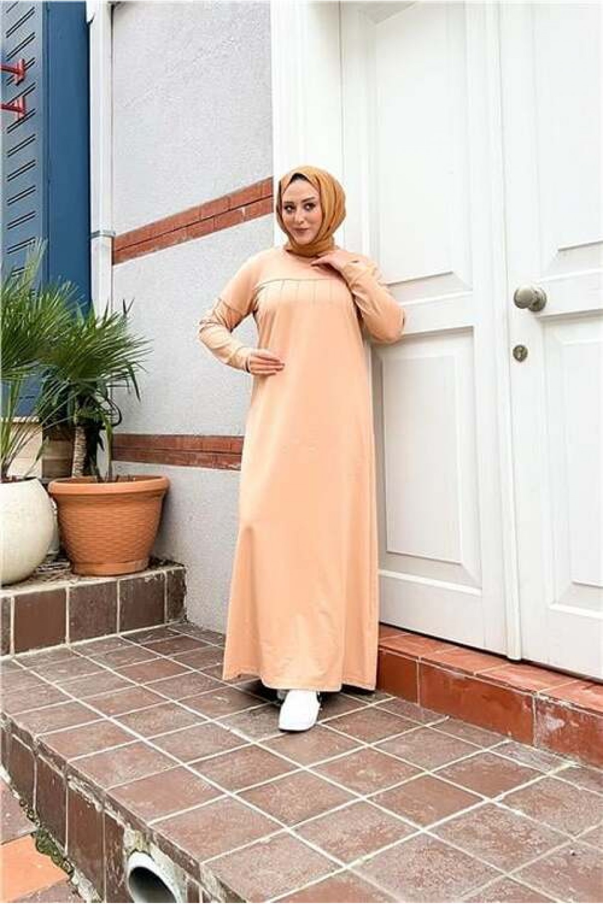 Short, simple, basic, long, plus-size sports dress with pleats.