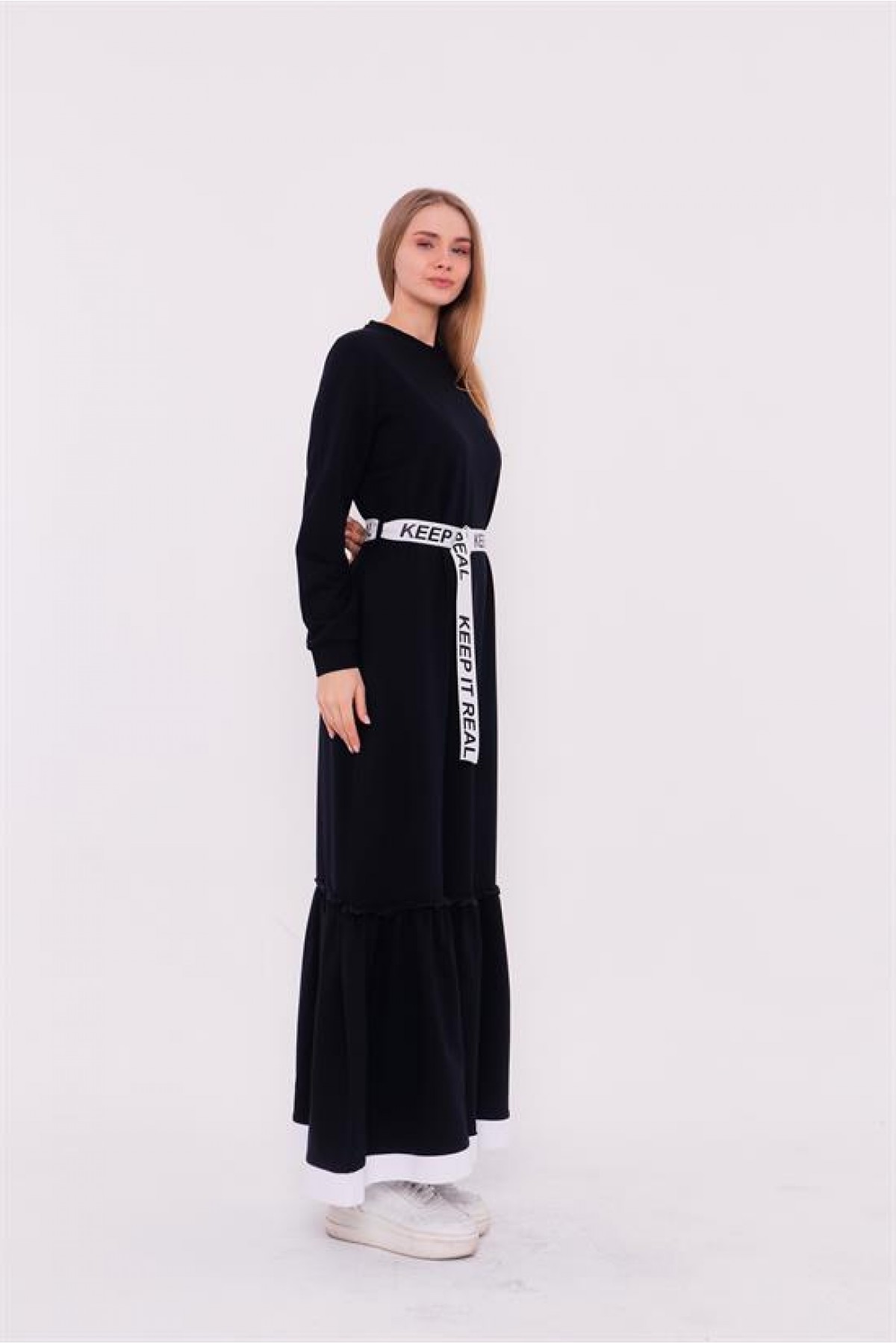 Moss-patterned, belted, and ruffle-detailed sports dress.