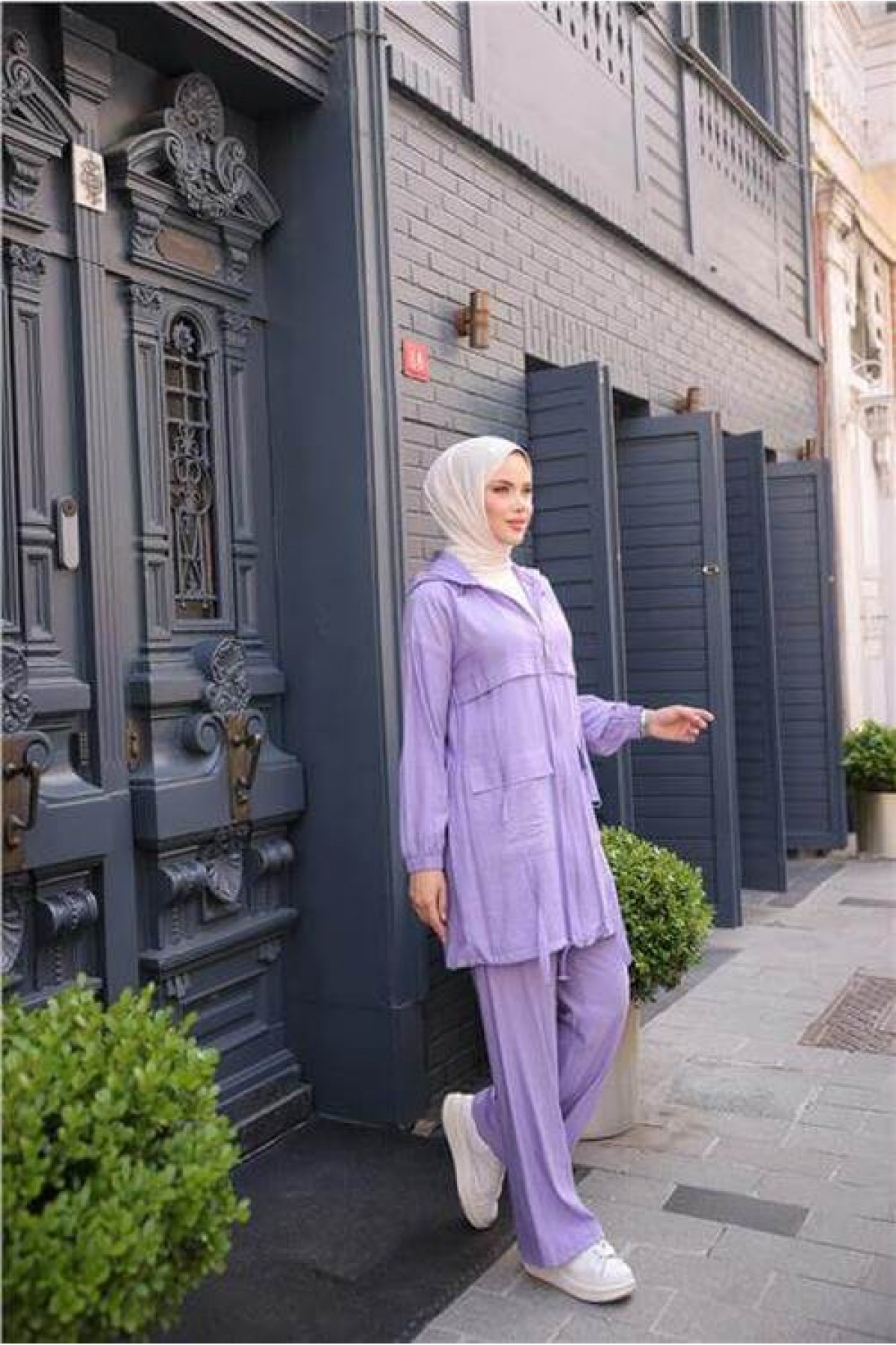 Short, two-piece modest tracksuit set with zipper, hood, and pockets.
