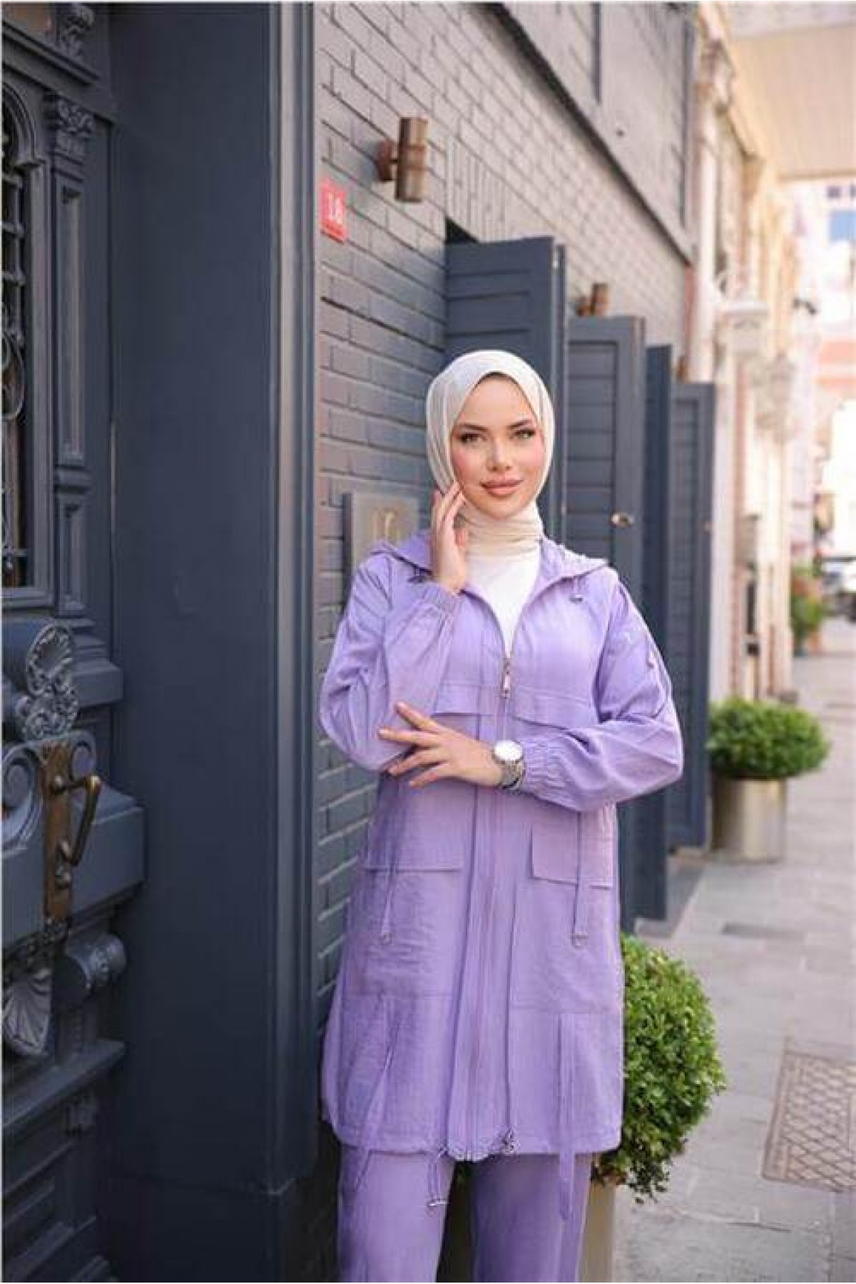 Short, two-piece modest tracksuit set with zipper, hood, and pockets.