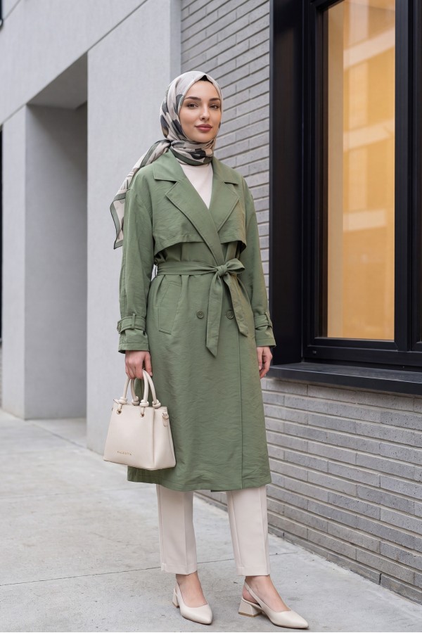 Trench coat made of polyester fabric with belt, pockets, and epauletted sleeves. -Khaki