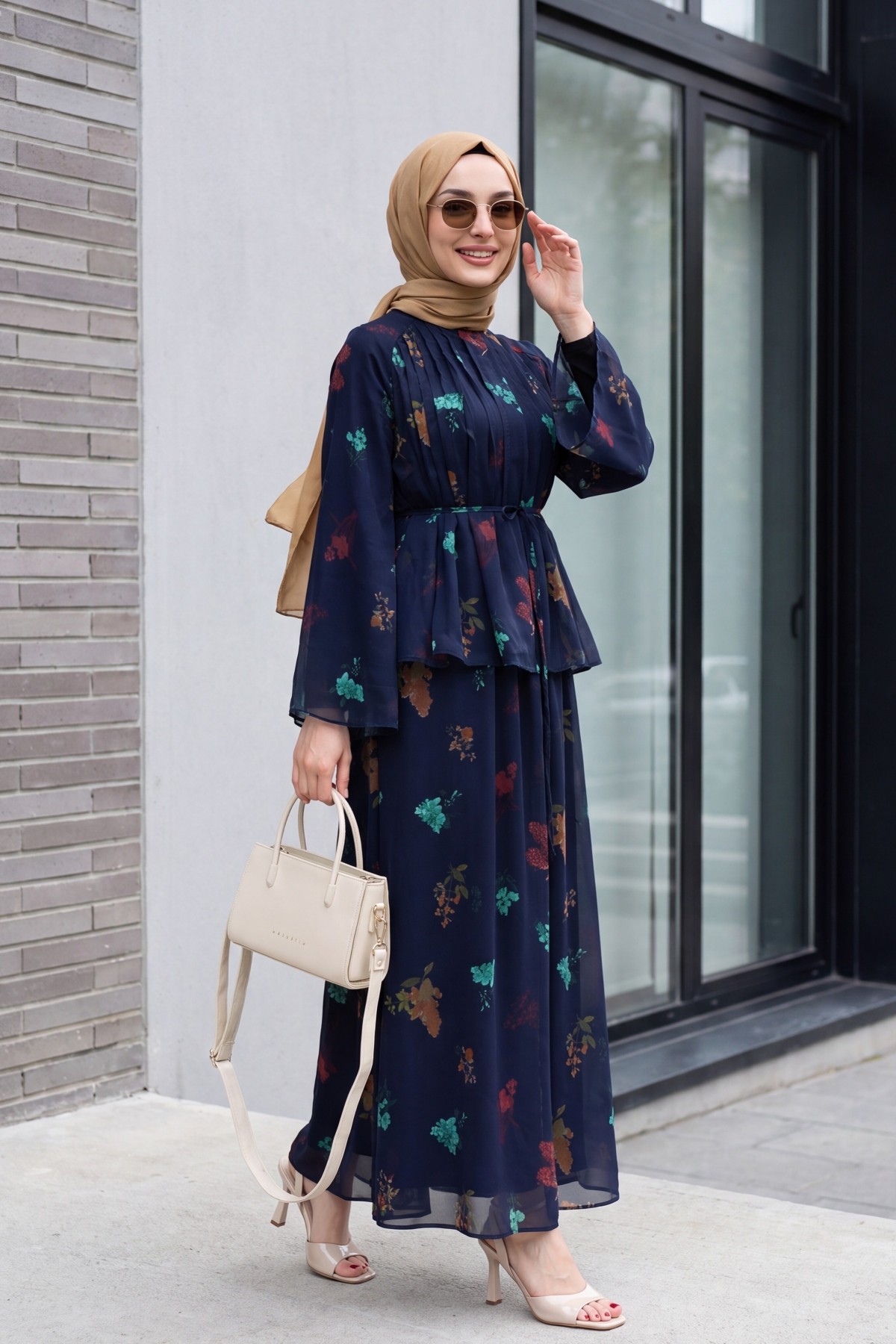 Spanish-style chiffon set with lined sleeves, belt, and floral skirt. -Navy blue