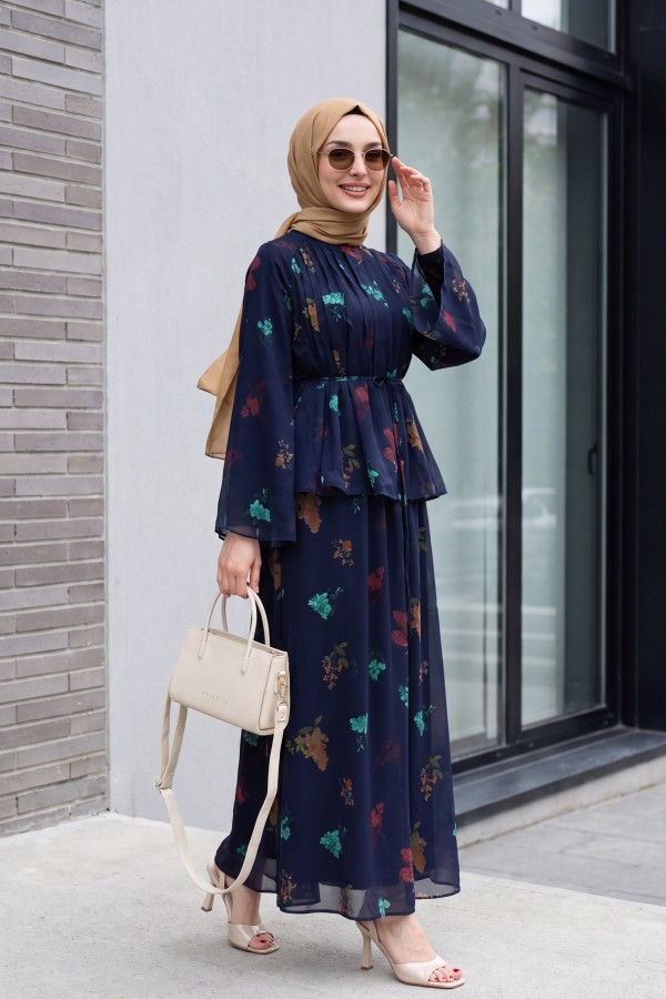 Spanish-style chiffon set with lined sleeves, belt, and floral skirt. -Navy blue