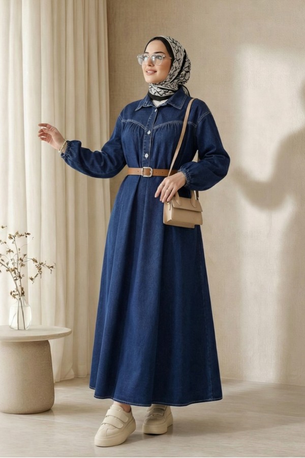 Half-buttoned denim dress with elasticated cuffs and belt. -Navy blue
