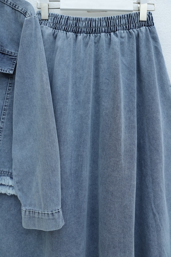Denim suit with tassel detail, front zipper, and pocket detail. -Ice Blue
