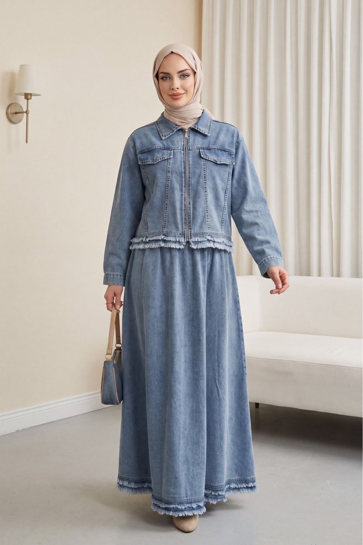 Denim suit with tassel detail, front zipper, and pocket detail. -Ice Blue