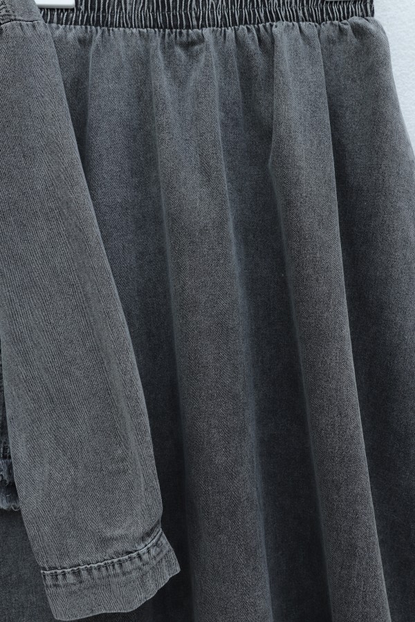 Denim suit with tassel detail, front zipper, and pocket detail. -Smoked 