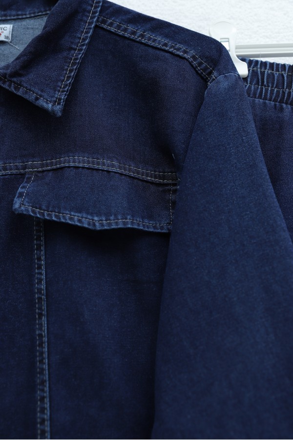 Denim suit with tassel detail, front zipper, and pocket detail. -Navy blue
