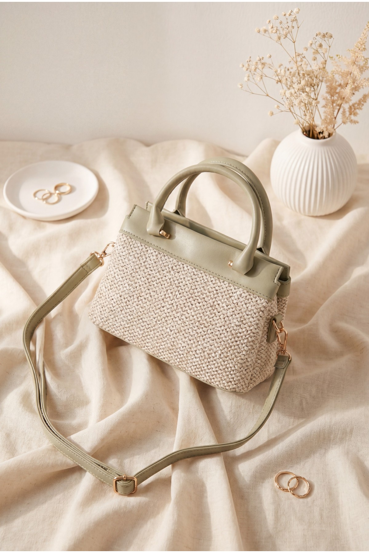 Long-strap, handle bag with knitted detail, zipper and snap closure. -Sea green
