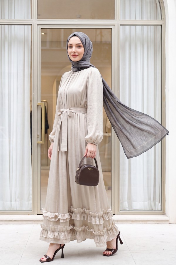Long dress with ruffled neckline and hem, elasticated sleeves, crinkle crepe lining. -Stone