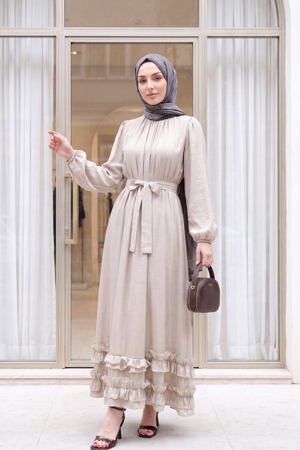 Long dress with ruffled neckline and hem, elasticated sleeves, crinkle crepe lining. -Stone