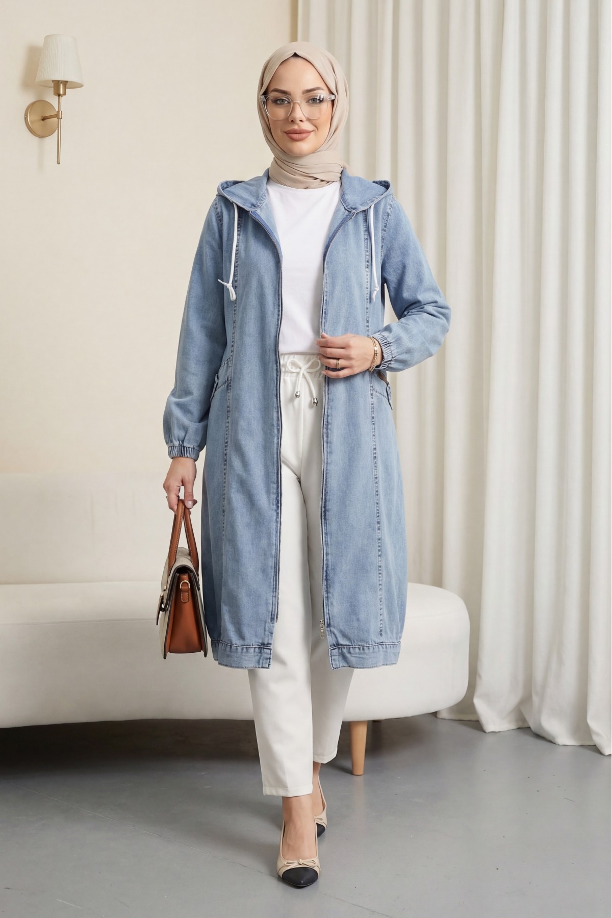 Hooded denim jacket with pockets, elasticated cuffs, and front zip closure. -Ice Blue