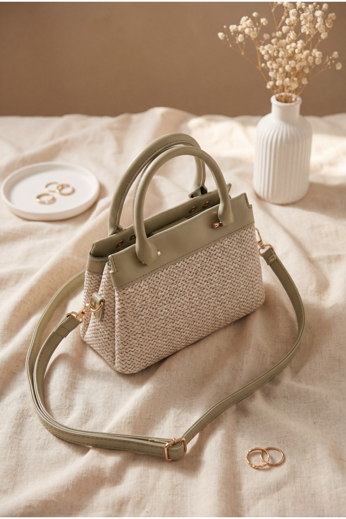 Long-strap, handle bag with knitted detail, zipper and snap closure. -Sea green