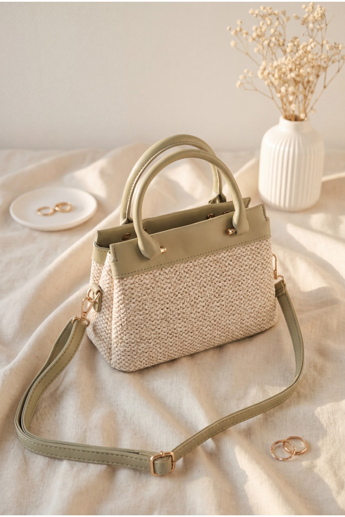 Long-strap, handle bag with knitted detail, zipper and snap closure. -Sea green