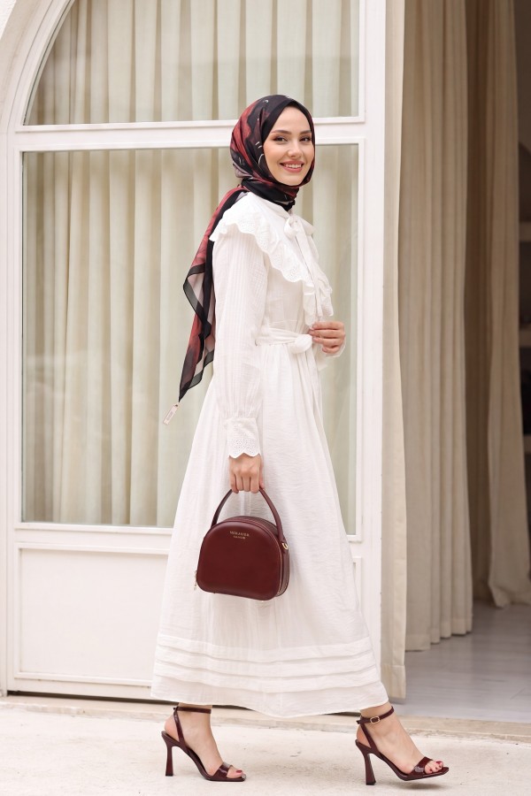 Lined crinkle dress with lace detailing at the neckline and waist.   -White