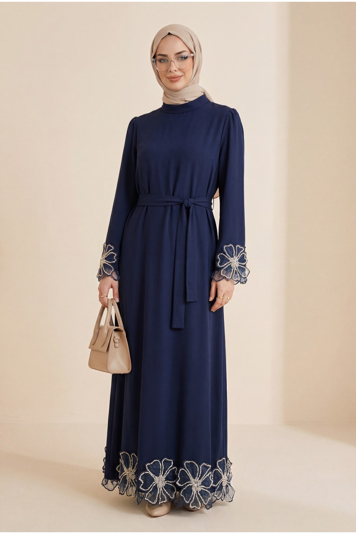 Lace-up crepe dress with floral stone details on sleeves and hem. -Navy blue