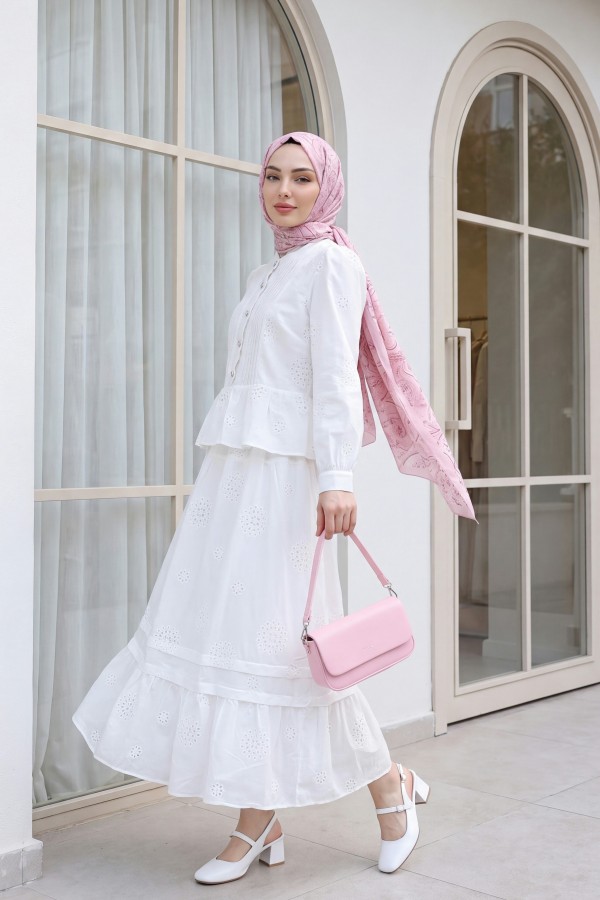 Linen suit with ribbed front, stone buttons, ruffled hem, and lined skirt. -White