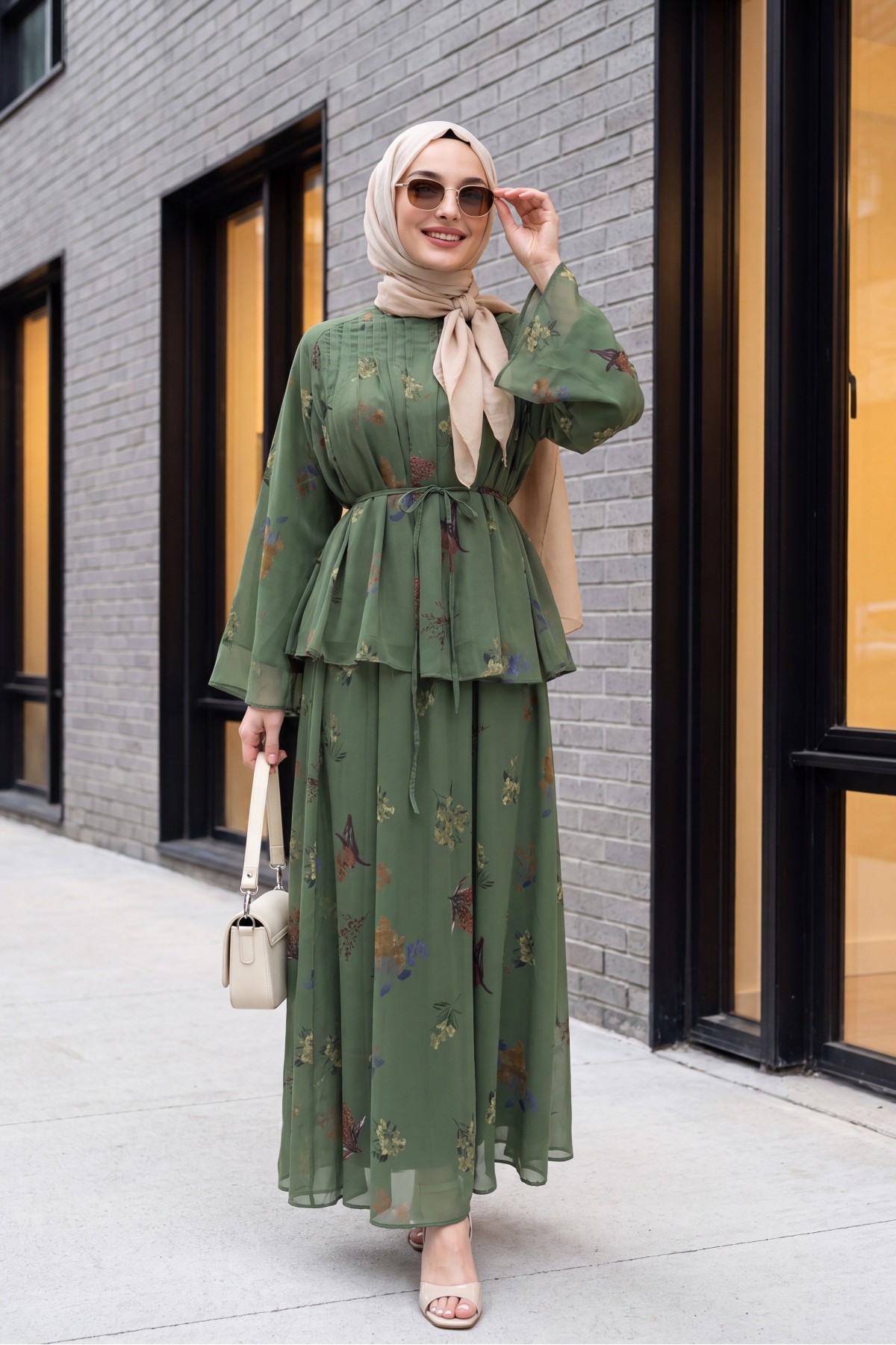 Spanish-style chiffon set with lined sleeves, belt, and floral skirt. -Khaki