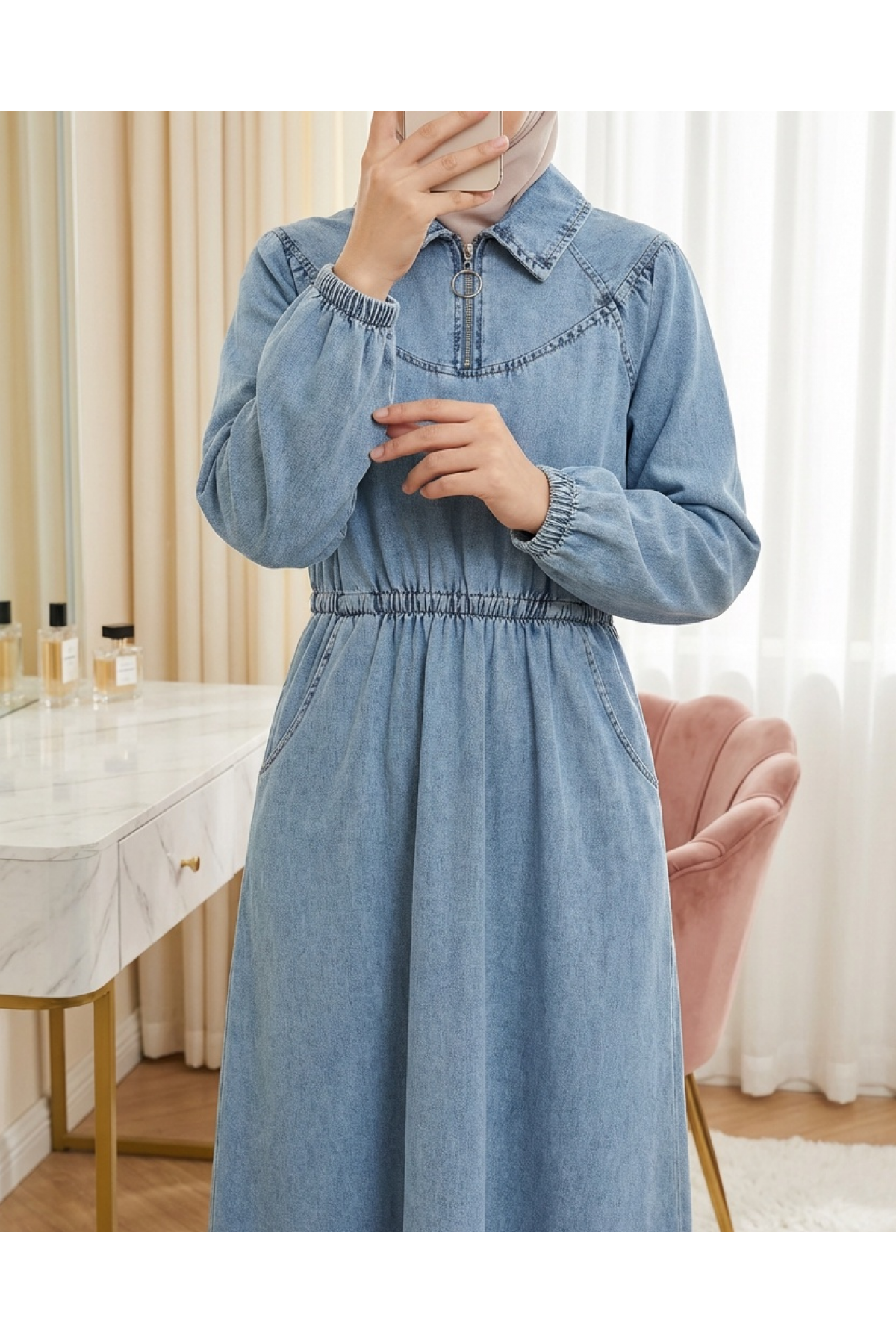 Denim dress with zipper closure, elasticated waist and cuffs, and pockets. -Ice Blue