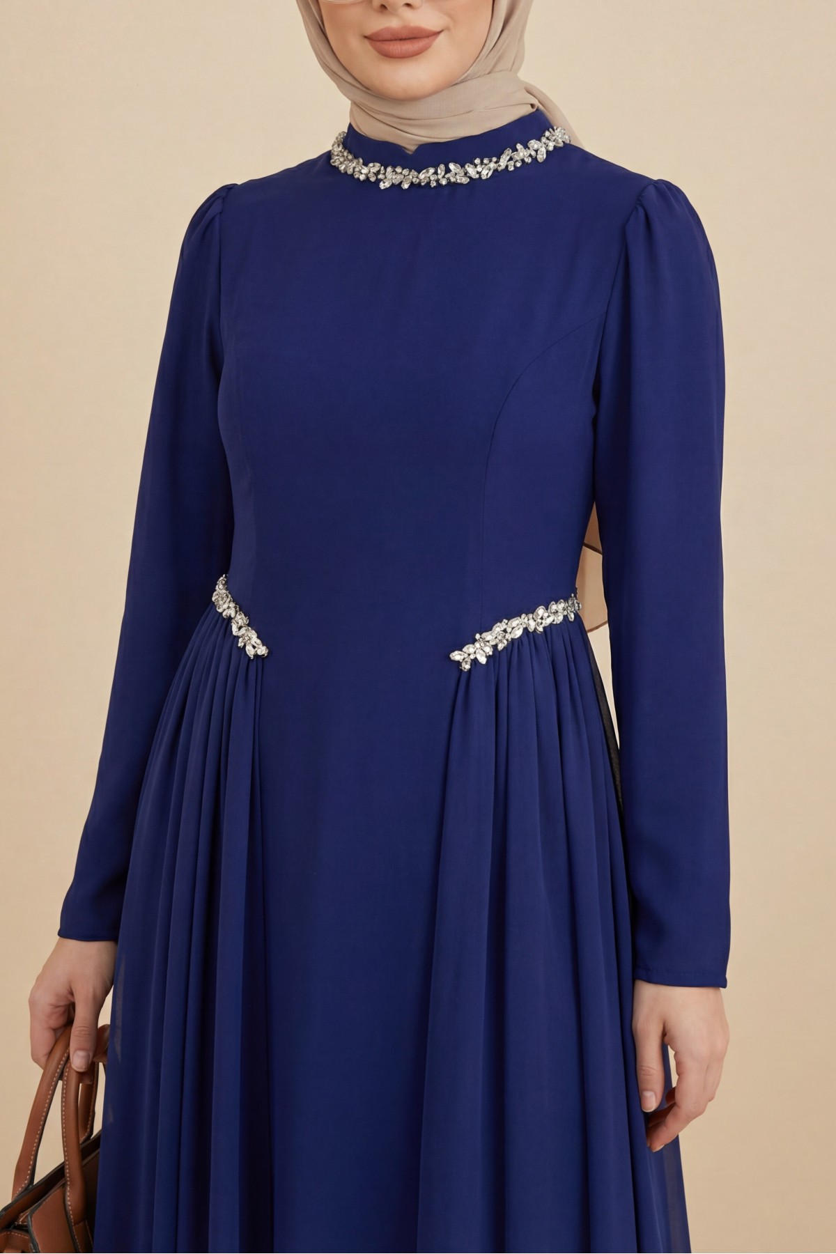 Crepe dress with rhinestone embellishments at the neckline and waist, and tulle details on the sides, now lined.  -Saxe 