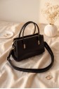 Long-strap patent leather bag with zipper closure and handles. -Black