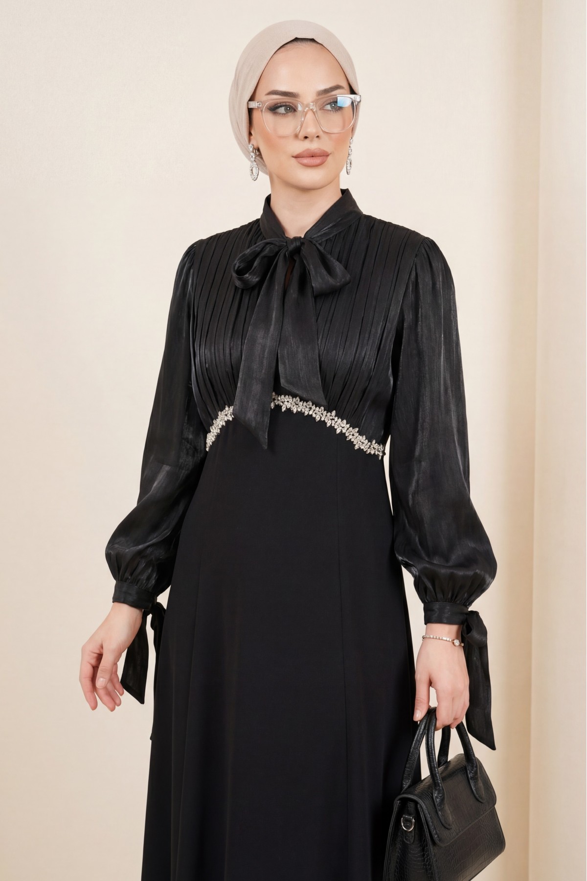 Pleated top with lace-up collar and sleeves, shimmering satin crepe skirt. -Black