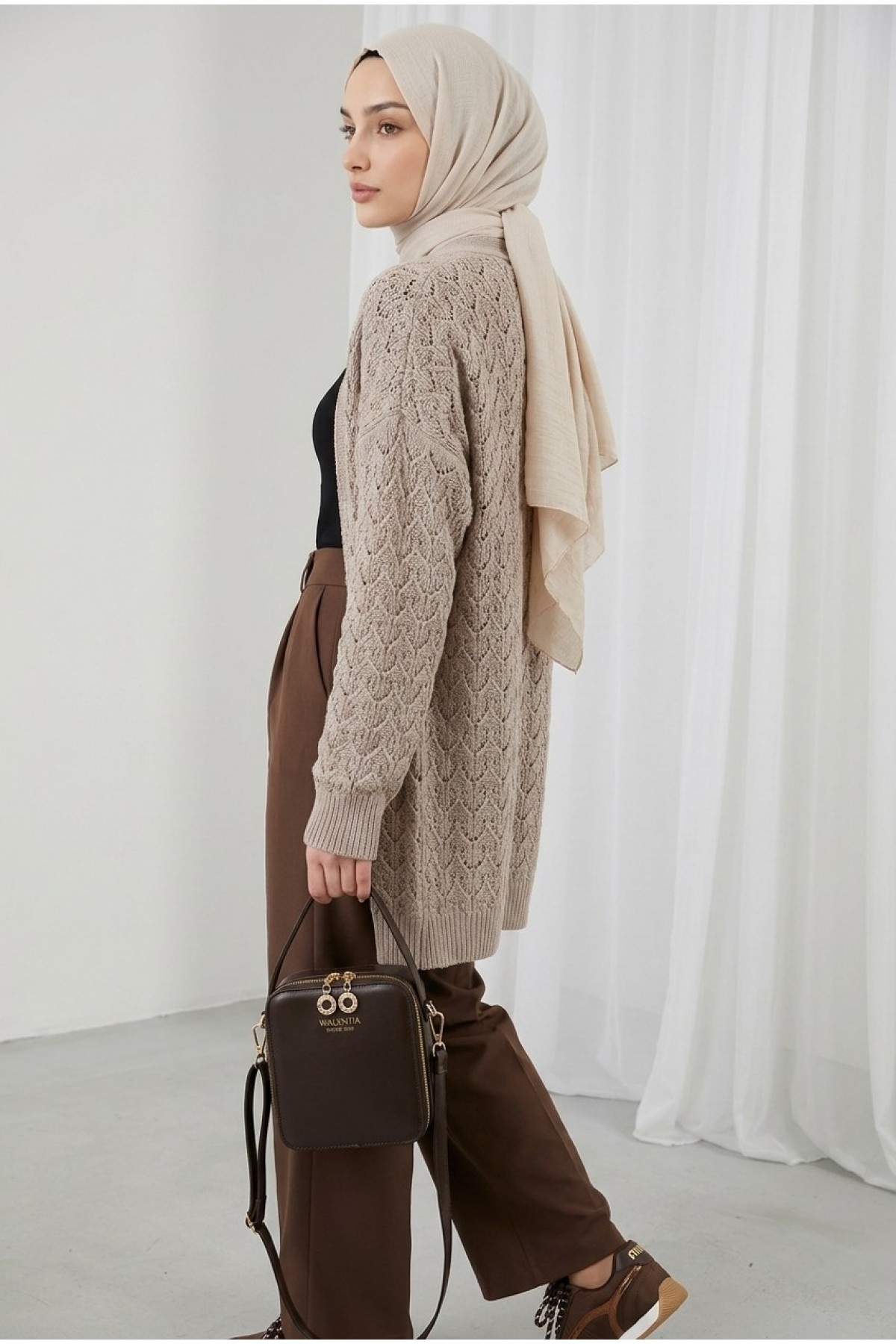 Loose-fitting knitted cardigan with openwork pattern. -Powder