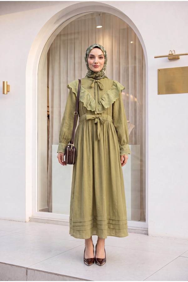 Lined crinkle dress with lace detailing at the neckline and waist. -Oil Green
