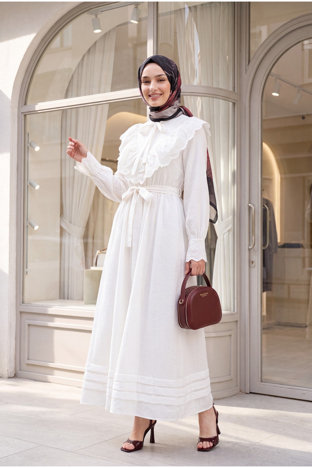 Lined crinkle dress with lace detailing at the neckline and waist.   -White