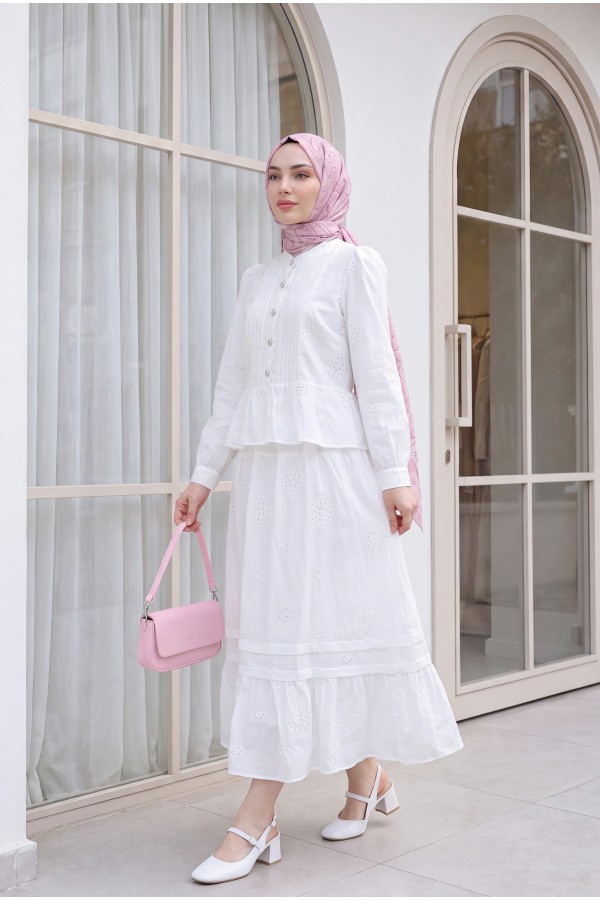 Linen suit with ribbed front, stone buttons, ruffled hem, and lined skirt. -White