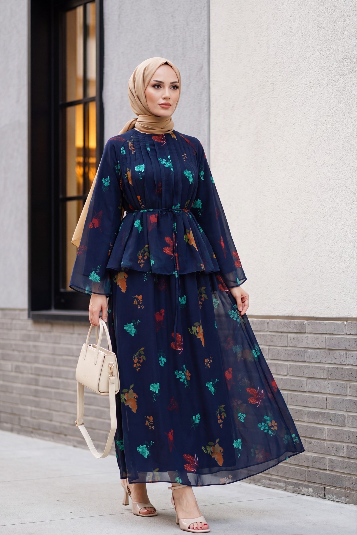 Spanish-style chiffon set with lined sleeves, belt, and floral skirt. -Navy blue