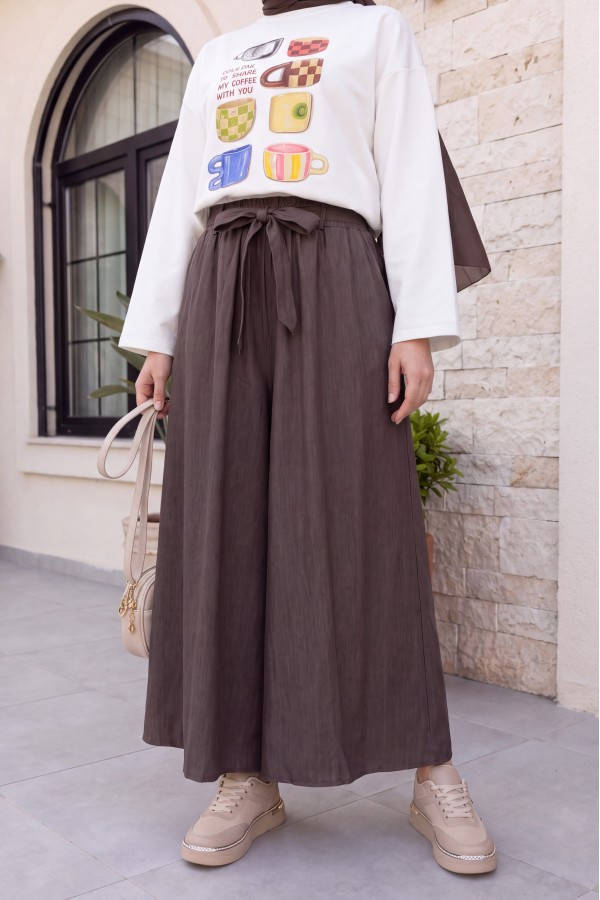 Linen-look skirt/pants with elasticated waist, belt, and pockets. - Soil