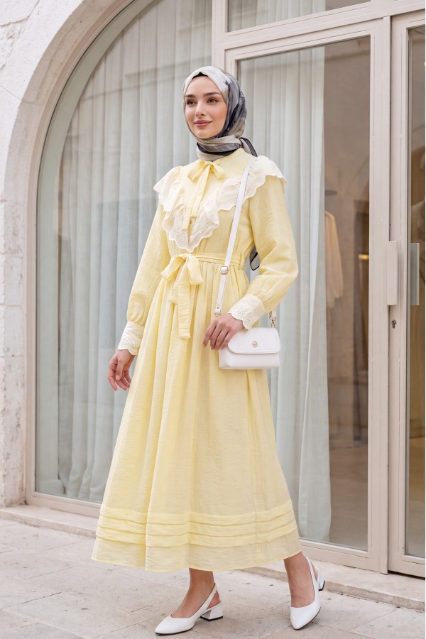 Lined crinkle dress with lace detailing at the neckline and waist. -Yellow