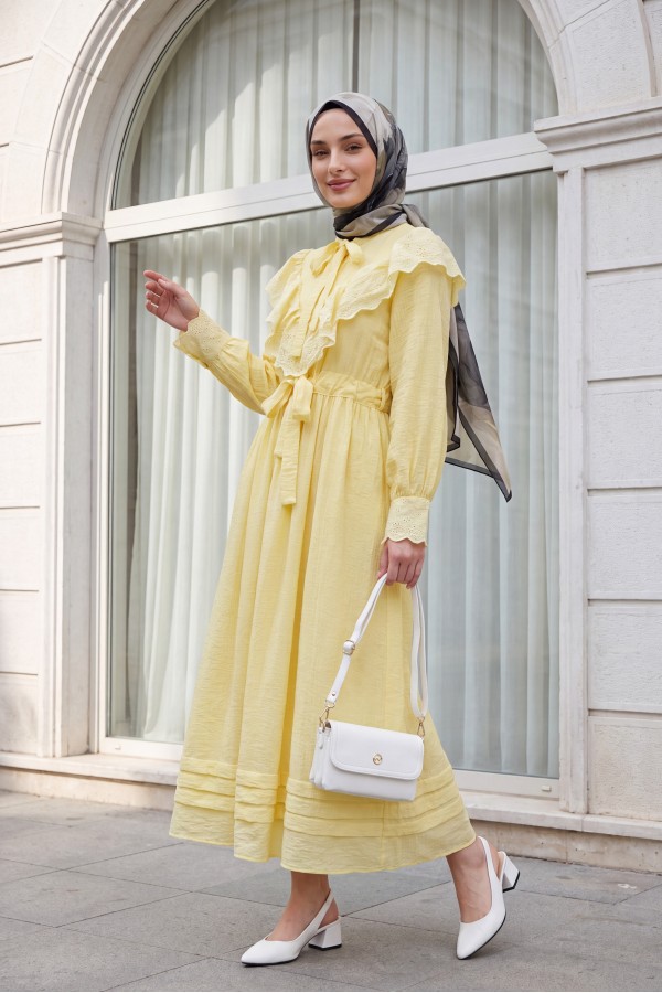 Lined crinkle dress with lace detailing at the neckline and waist. -Yellow