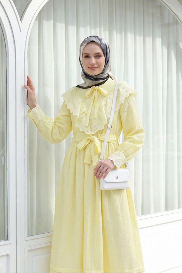 Lined crinkle dress with lace detailing at the neckline and waist. -Yellow