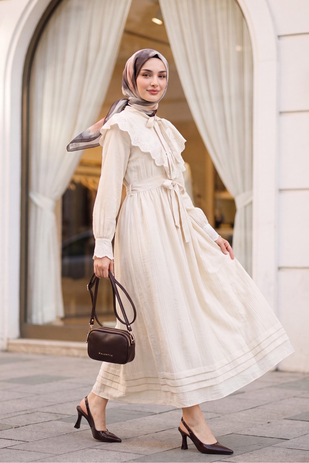 Lined crinkle dress with lace detailing at the neckline and waist. -Stone