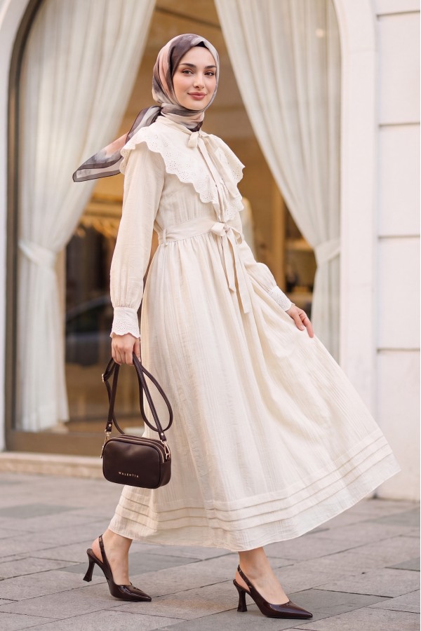 Lined crinkle dress with lace detailing at the neckline and waist. -Stone