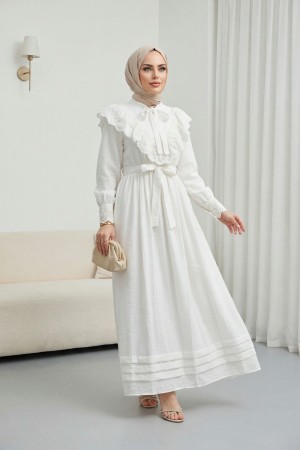 Lined crinkle dress with lace detailing at the neckline and waist.   -White