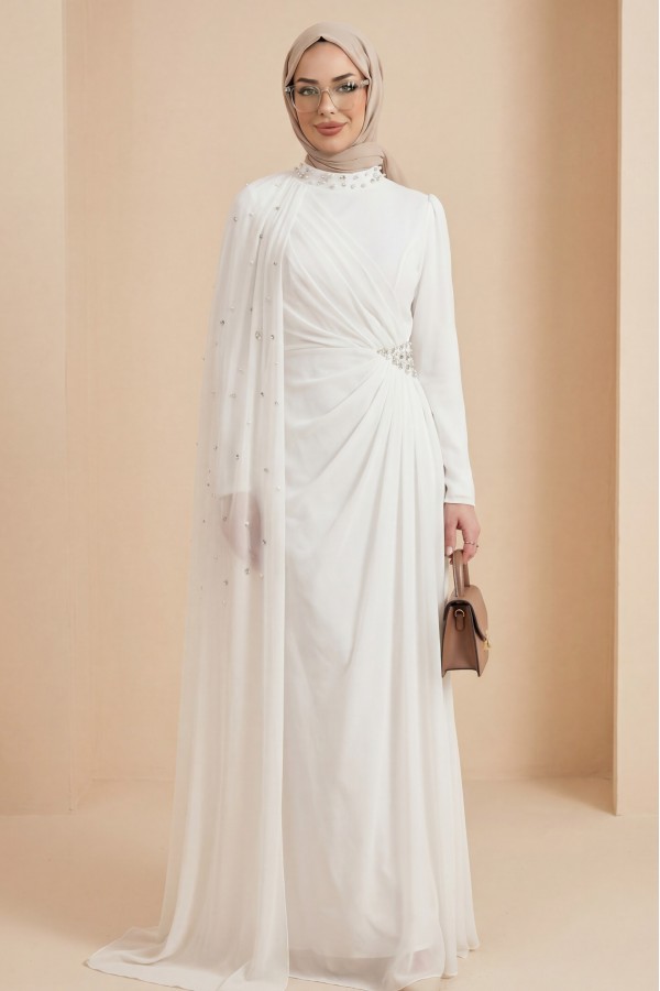 High-neck evening gown with pearl detail and tulle cape. -White