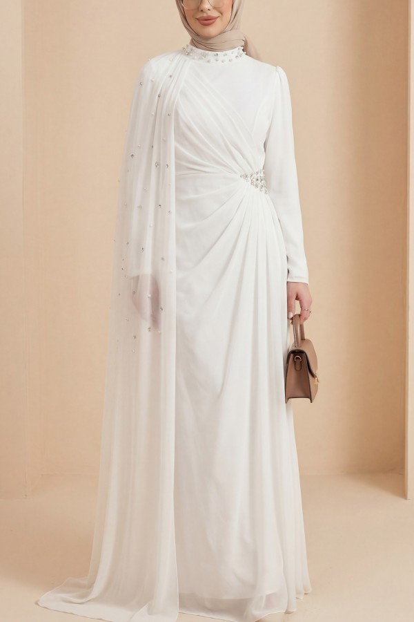 High-neck evening gown with pearl detail and tulle cape. -White