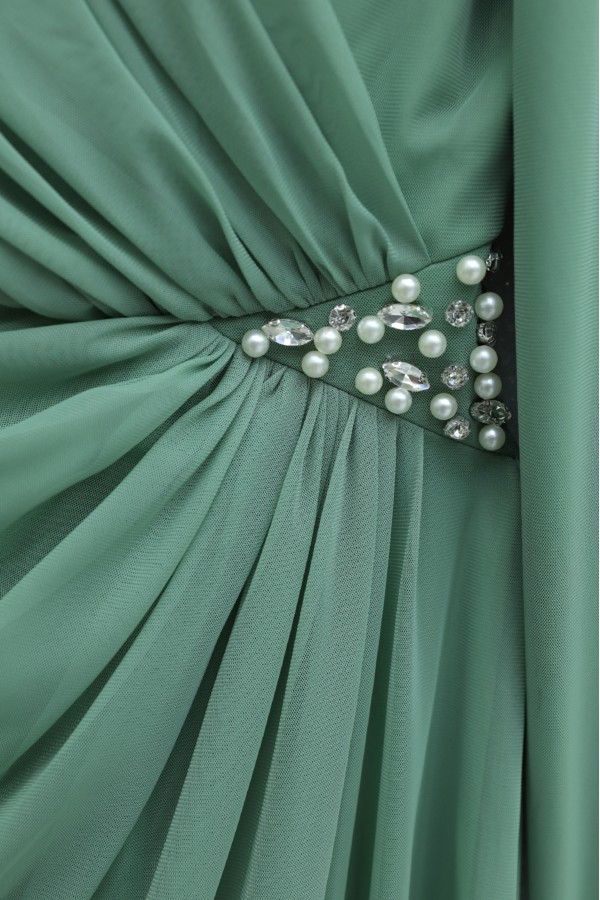 High-neck evening gown with pearl detail and tulle cape. -Cagla Green