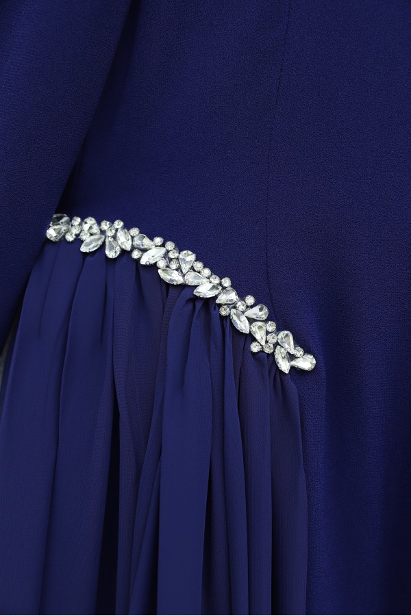 Crepe dress with rhinestone embellishments at the neckline and waist, and tulle details on the sides, now lined.  -Saxe 