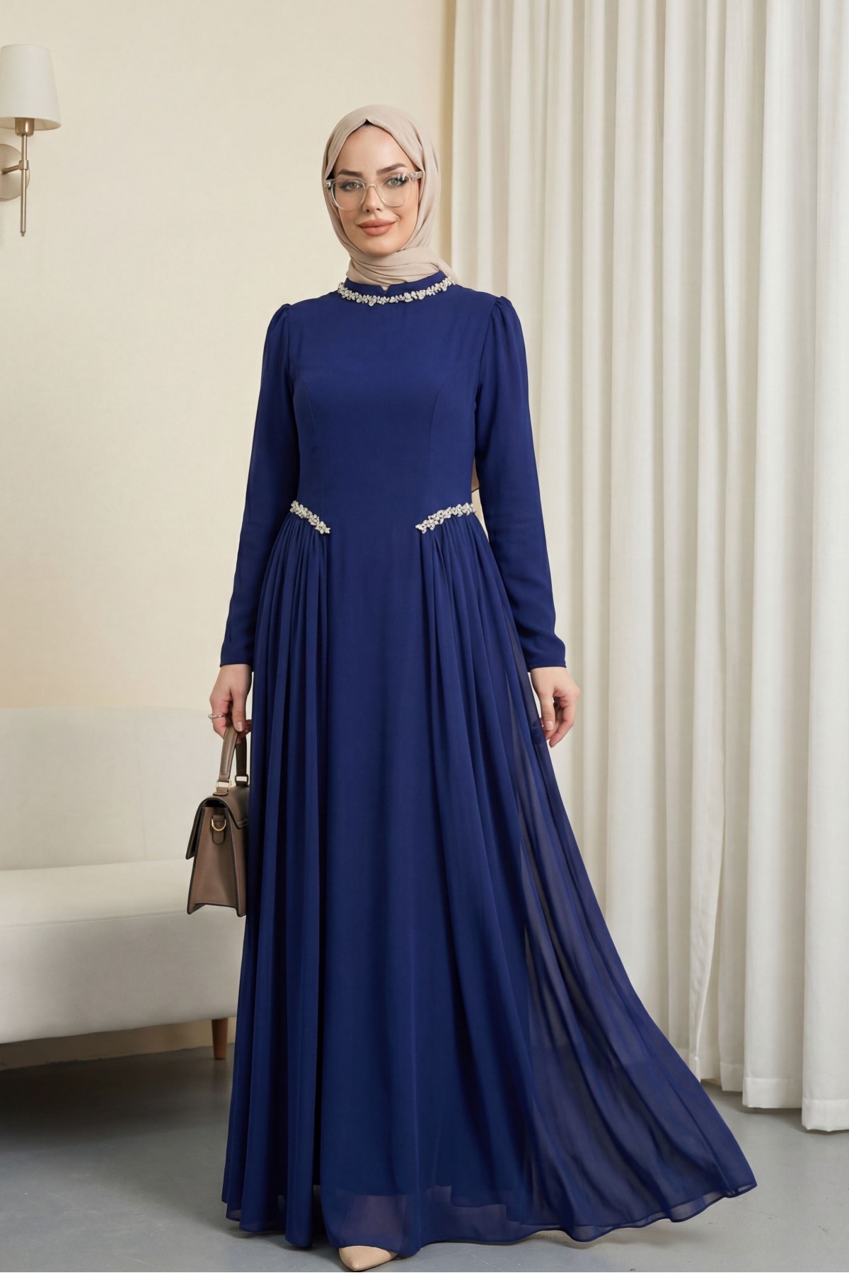 Crepe dress with rhinestone embellishments at the neckline and waist, and tulle details on the sides, now lined.  -Saxe 