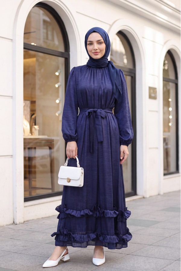 Long dress with ruffled neckline and hem, elasticated sleeves, crinkle crepe lining. -Navy blue