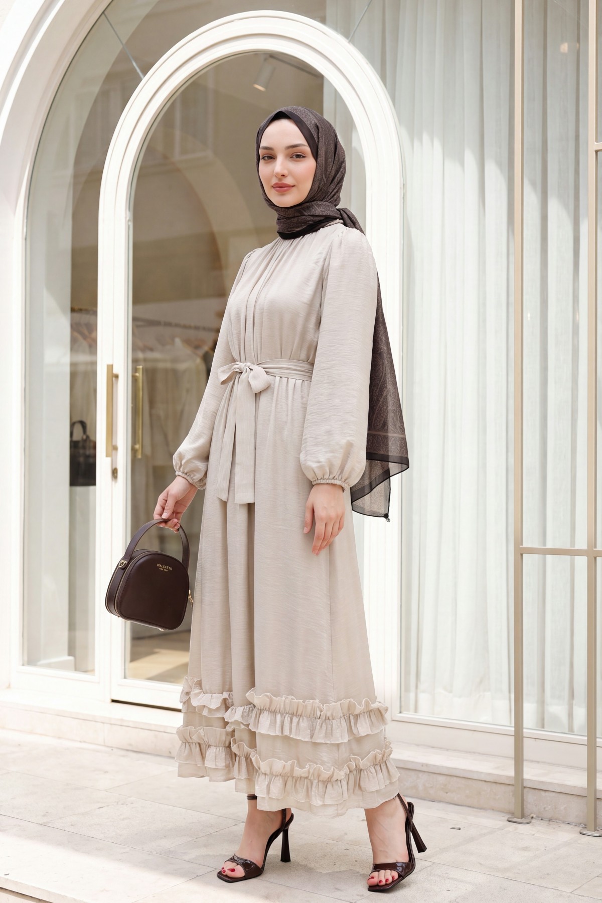 Long dress with ruffled neckline and hem, elasticated sleeves, crinkle crepe lining. -Stone