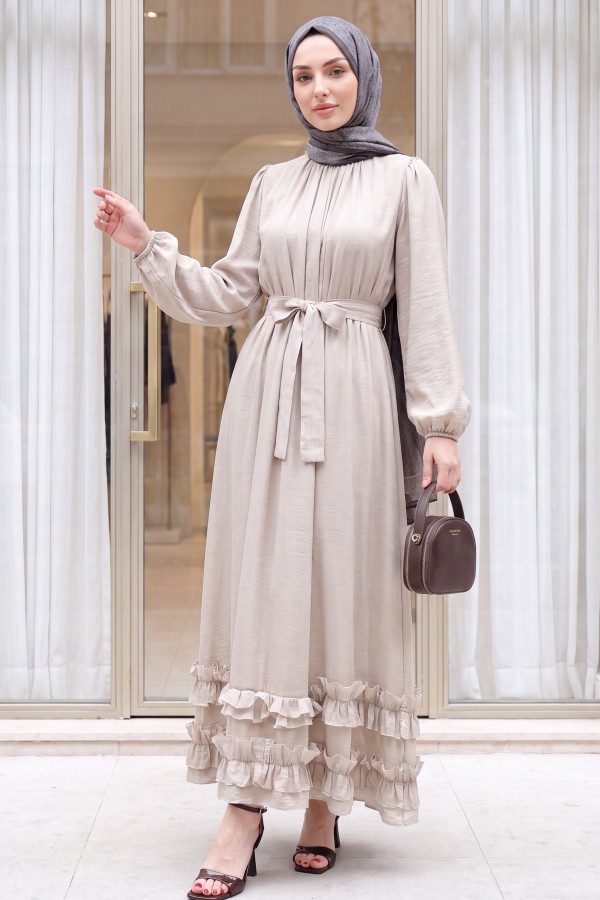 Long dress with ruffled neckline and hem, elasticated sleeves, crinkle crepe lining. -Stone