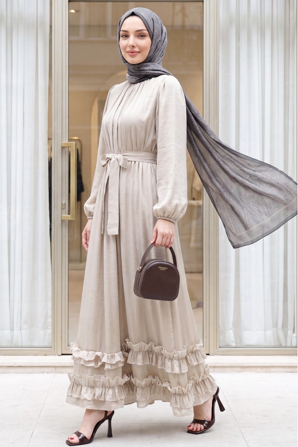 Long dress with ruffled neckline and hem, elasticated sleeves, crinkle crepe lining. -Stone
