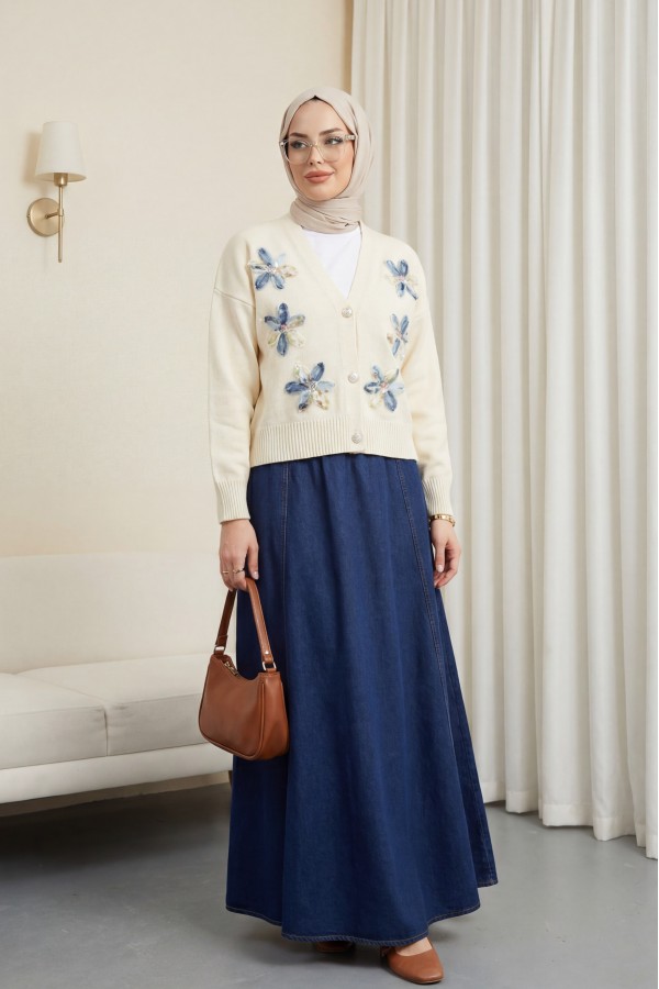 Buttoned knitted cardigan with sequin and floral details on the front. -Cream color
