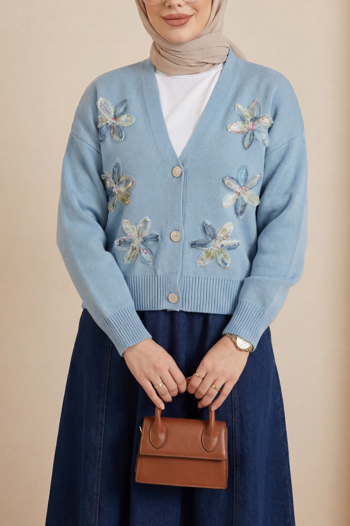 Buttoned knitted cardigan with sequin and floral details on the front. -Blue