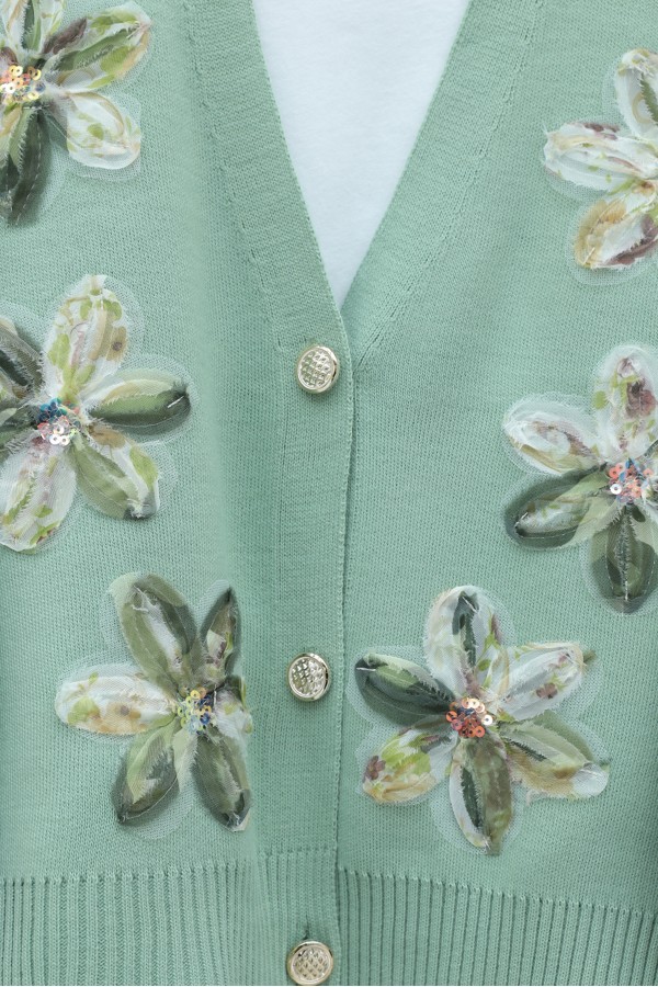 Buttoned knitted cardigan with sequin and floral details on the front. -Sea green